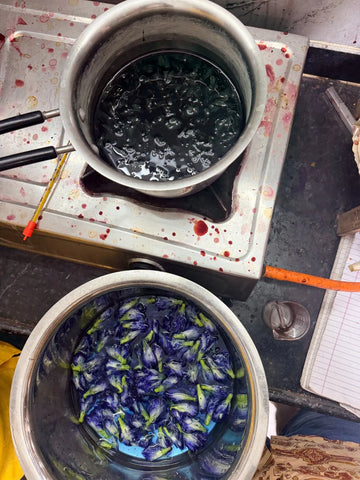 Natural dye experiment with blue flowers steeping in a dye bath at HKV Benaras